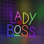 : LED neon sign displaying the phrase "Lady Boss," designed for wall decor in bedrooms, offices, or vanity spaces. USB powered, ideal for room decoration and empowering, feminine-themed spaces.