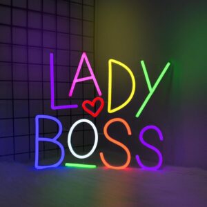 : LED neon sign displaying the phrase "Lady Boss," designed for wall decor in bedrooms, offices, or vanity spaces. USB powered, ideal for room decoration and empowering, feminine-themed spaces.