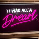 "Pink 'It Was All A Dream' LED neon sign for bedroom walls with adjustable dimmer – dreamy decor or photo backdrop."