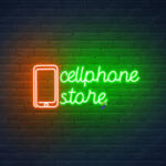 "Custom 'Cell Phone Store' LED Neon Sign glowing in blue and pink for shopfront display"