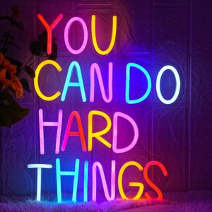 Motivational neon sign that reads “You Can Do Hard Things,” glowing brightly on a clear acrylic base—perfect for personal or workspaces.