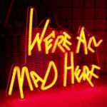 “We’re All Mad Here” neon sign inspired by Alice in Wonderland, perfect for wall decor in clubs, bedrooms, bars, or themed parties.