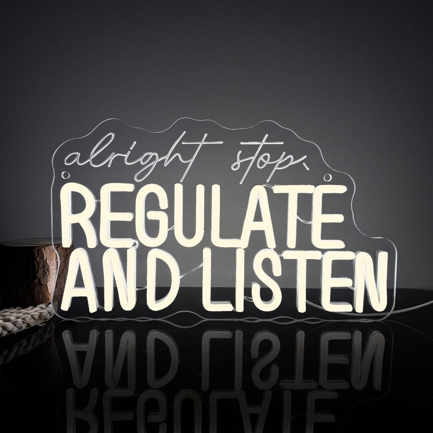 "Alright Stop Regulate and Listen" LED neon sign in bold lettering, ideal for wall decor in music rooms, bedrooms, or therapy spaces.