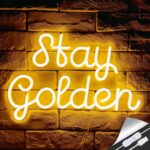 "Stay Golden" neon sign in glowing yellow script. A motivational LED light perfect for salons, bedrooms, or office inspiration walls.