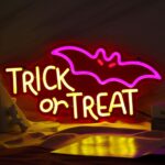 Vibrant Trick or Treat Halloween neon sign featuring purple bats and bold yellow lettering on red acrylic, perfect for spooky home decor or parties.