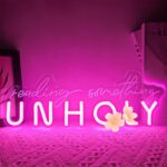 Reading Something Unholy Neon Sign in pink, USB-powered LED wall light for book lovers, perfect for girls' bedroom, bookshelf, or home library decor.
